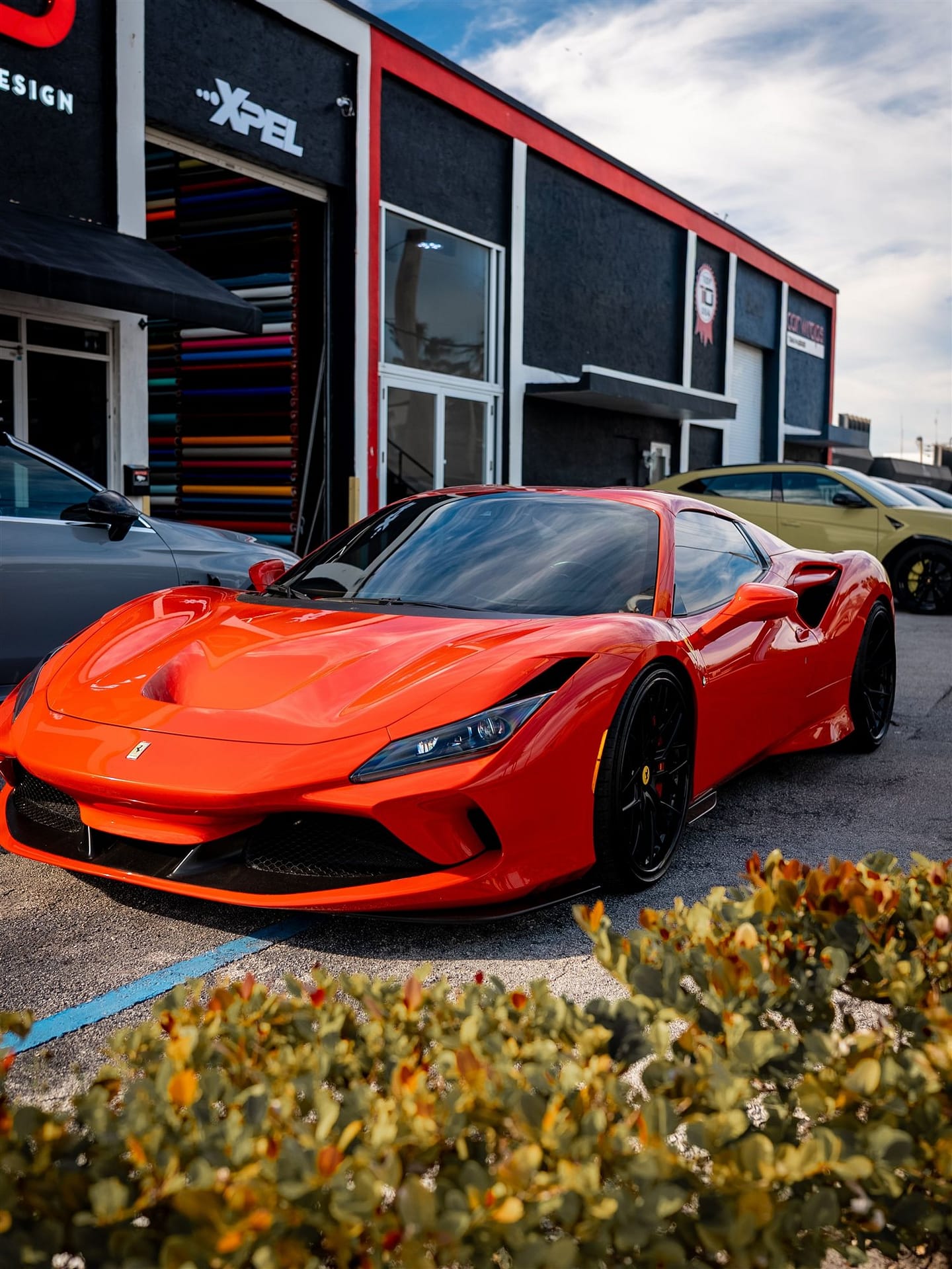Glossy red Ferrari F8 supercar wrap — car wraps, PPF and ceramic coating for Bal Harbour FL drivers