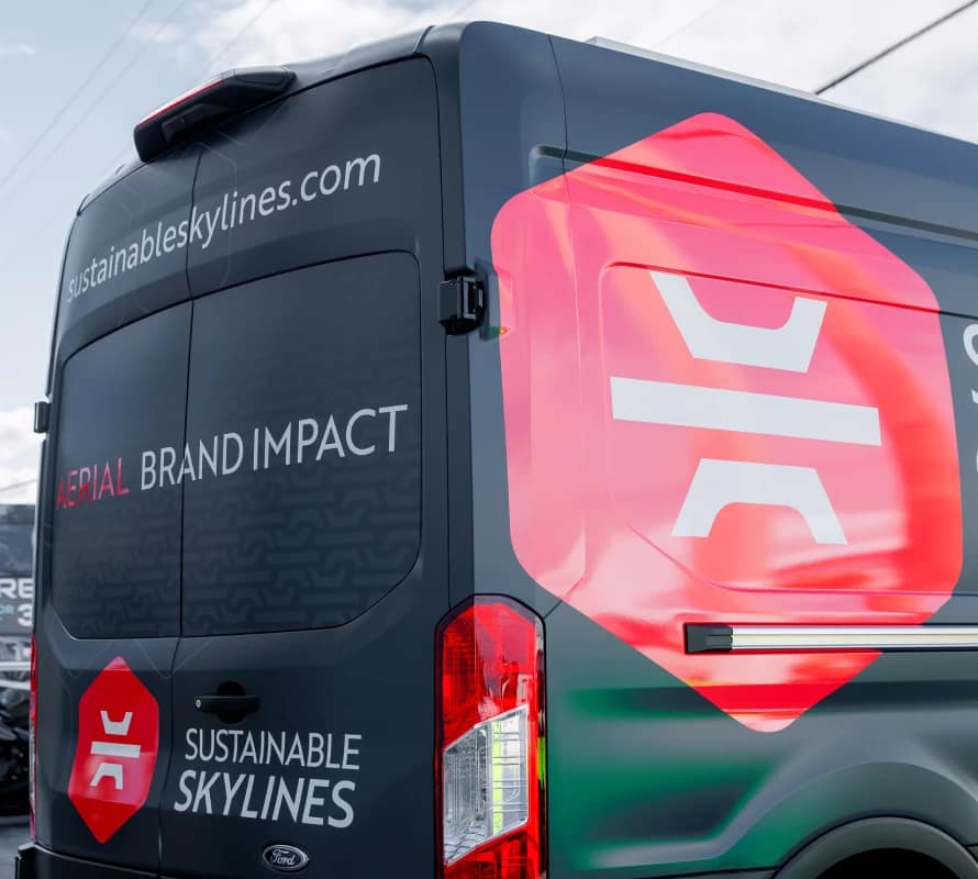 Spot graphics and partial wrap on work van Miami