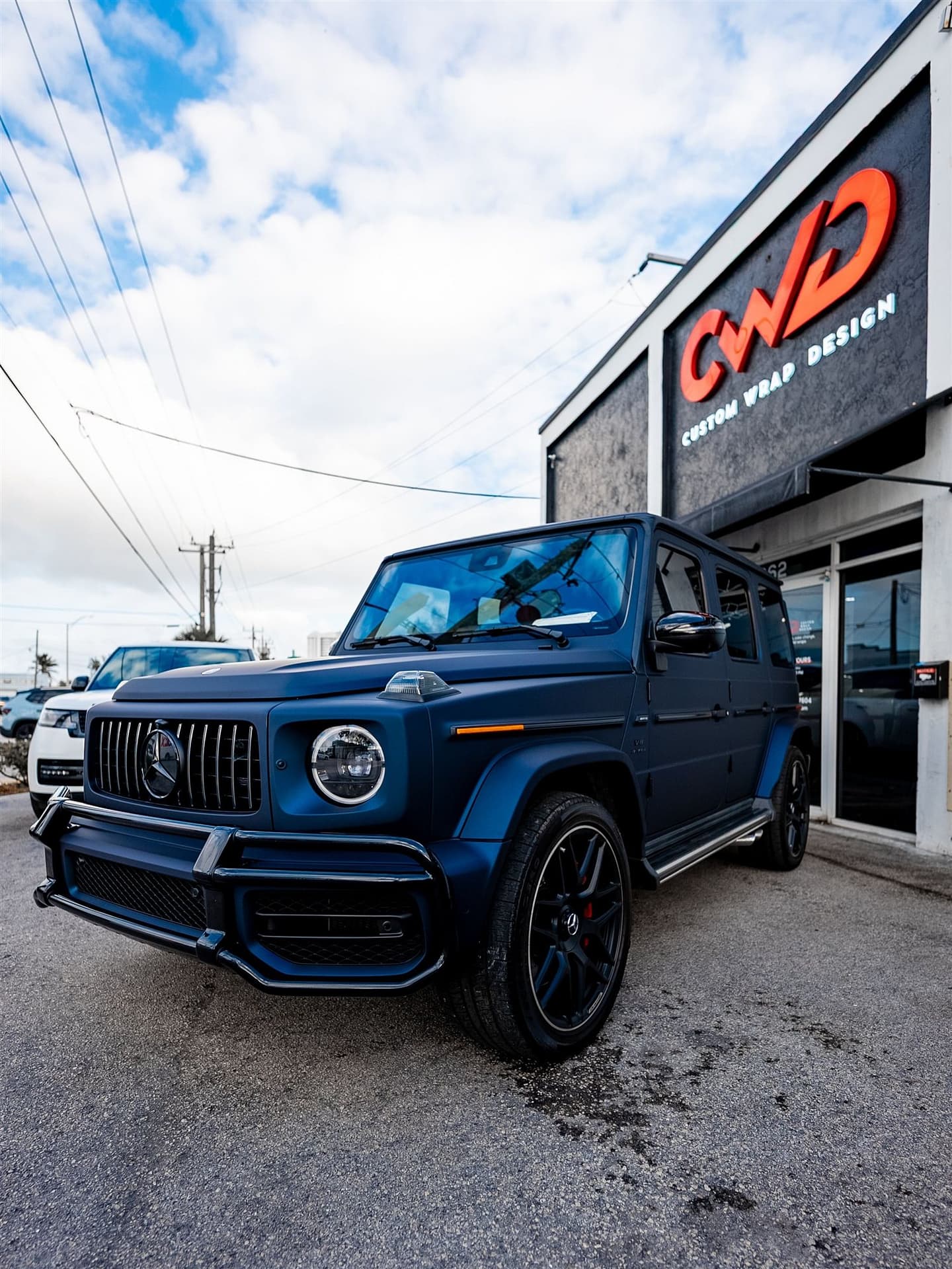 Satin blue Mercedes-AMG G63 in Miami — paint protection film removal and replacement